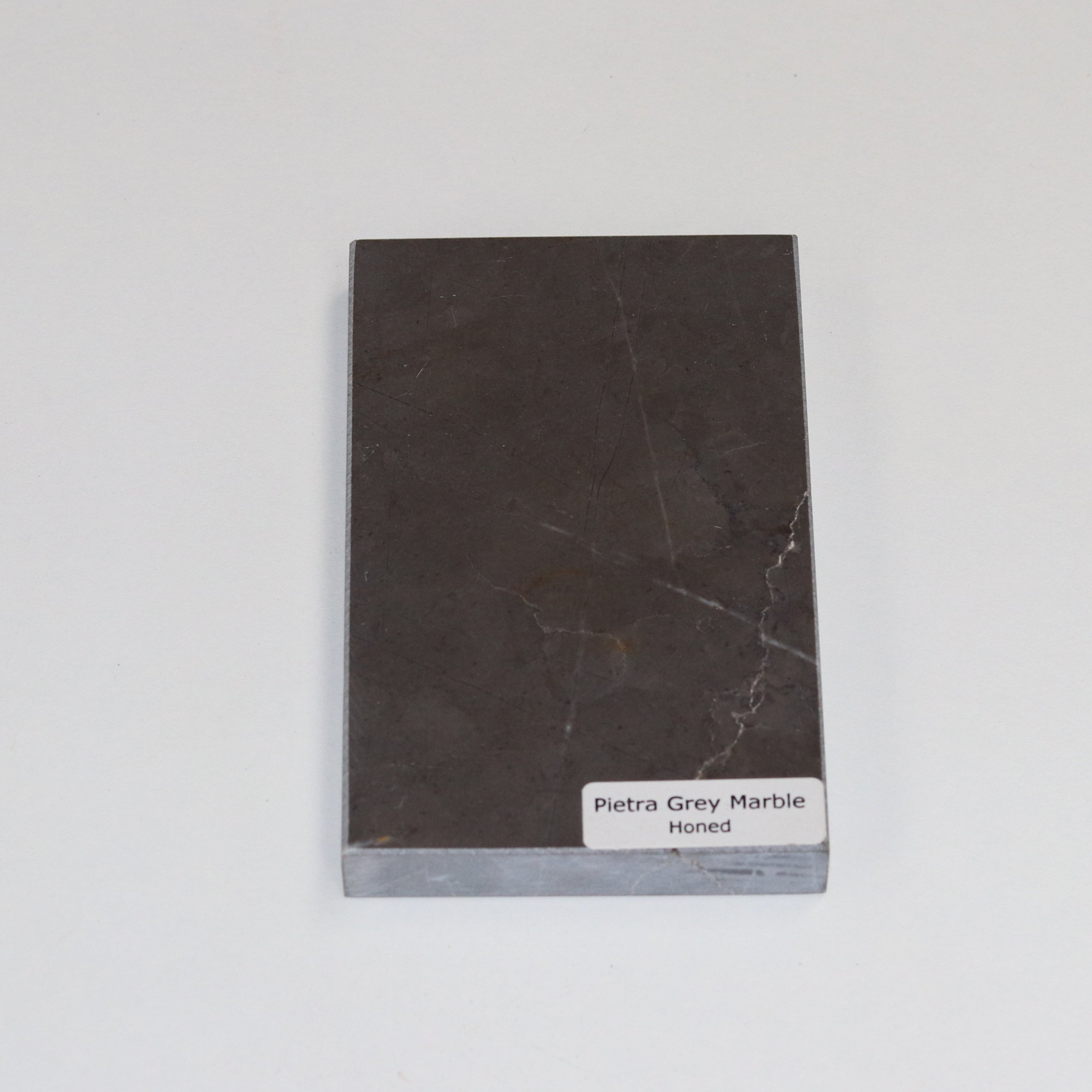 Honed Pietra Grey — soft matte texture with fine white veining