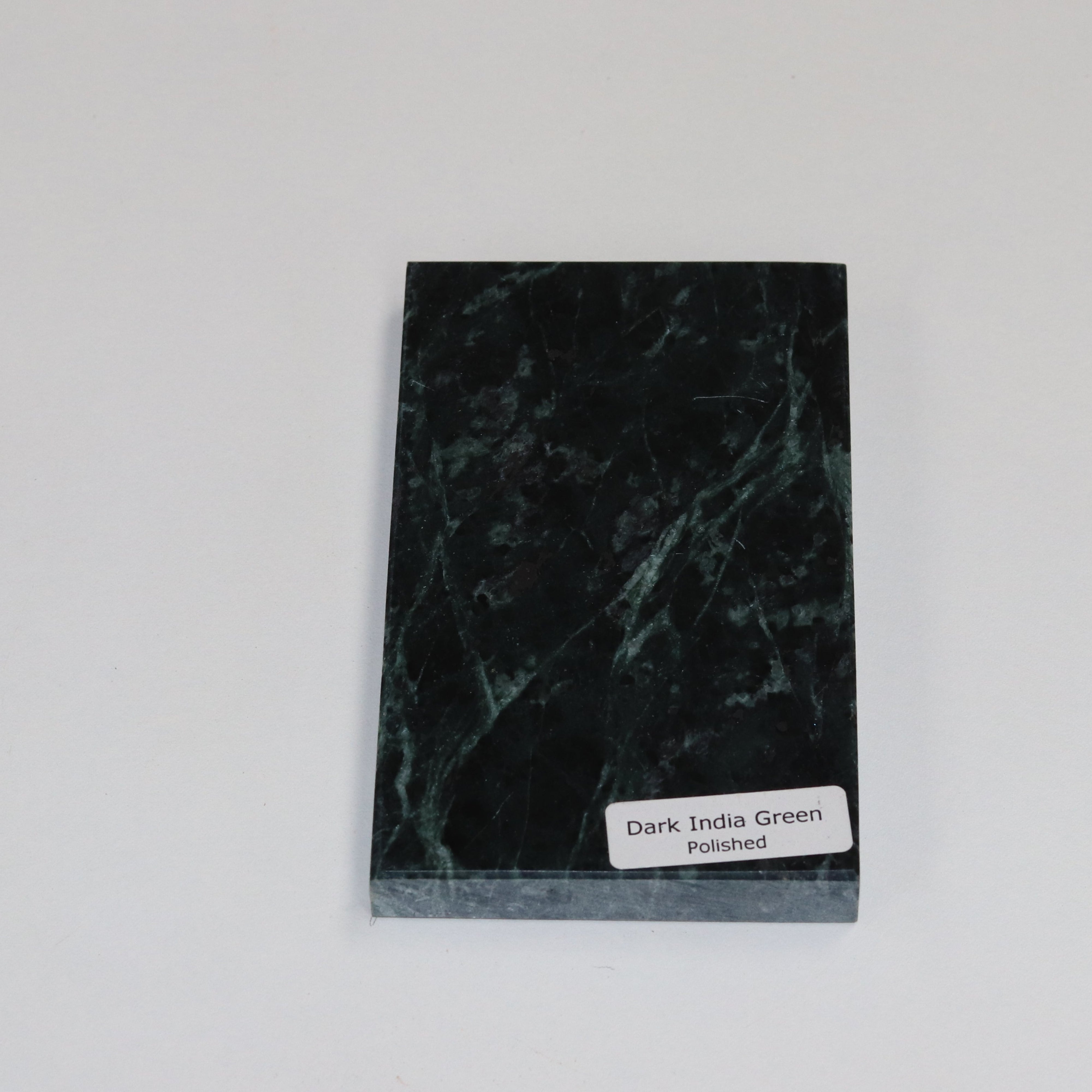 Polished Dark Indian Green — high‑gloss surface with dramatic tonal variation