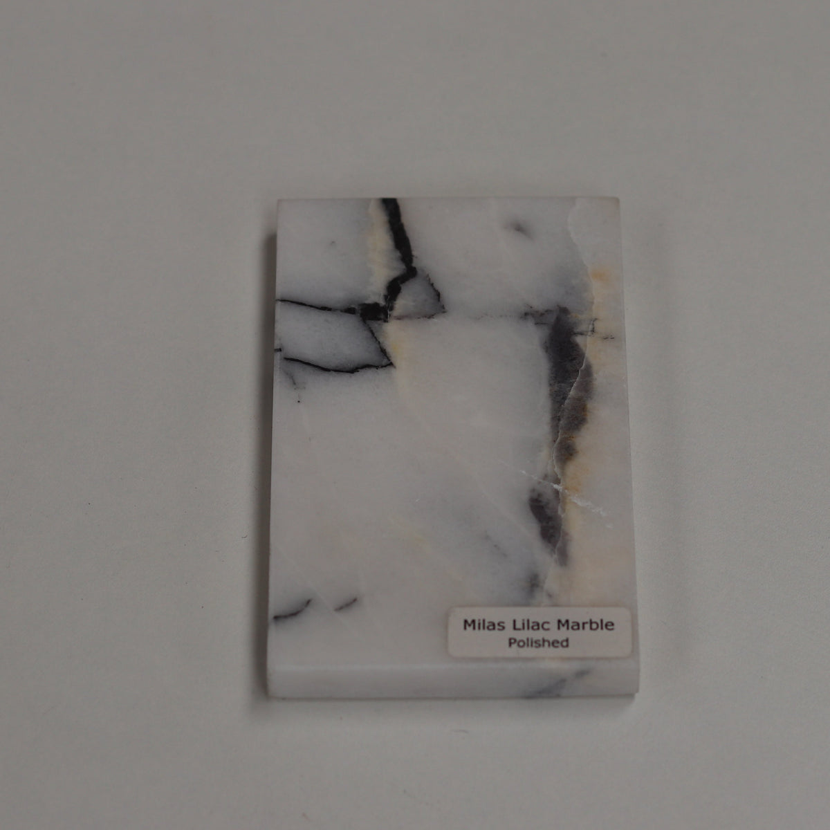 Polished Milas Lilac — high‑gloss surface with vivid lilac contrast