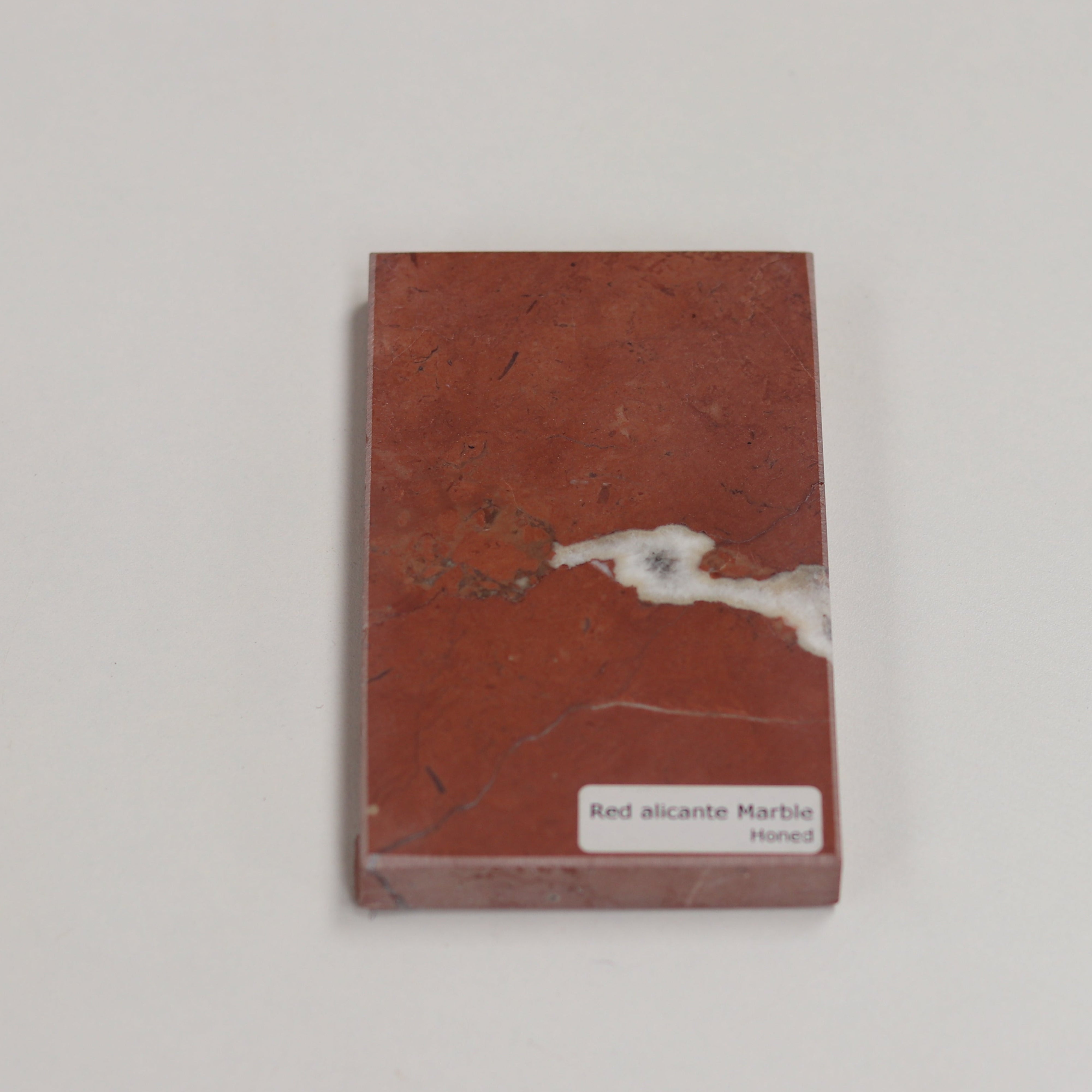 Honed Red Alicante — soft matte texture with warm terracotta tones