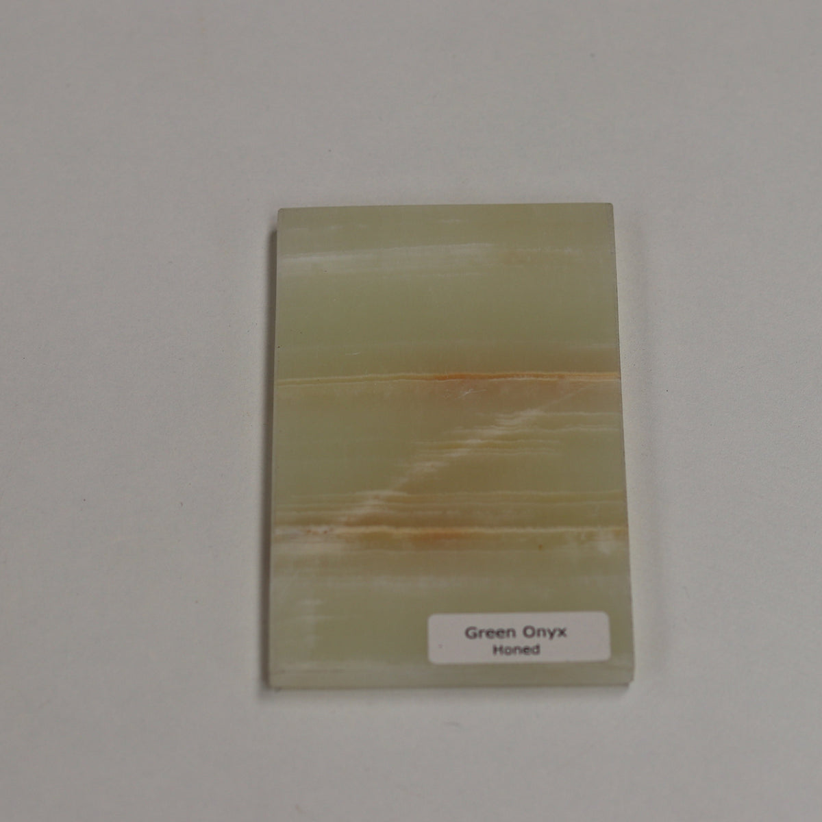 Honed Green Onyx — soft matte texture with layered emerald and jade banding