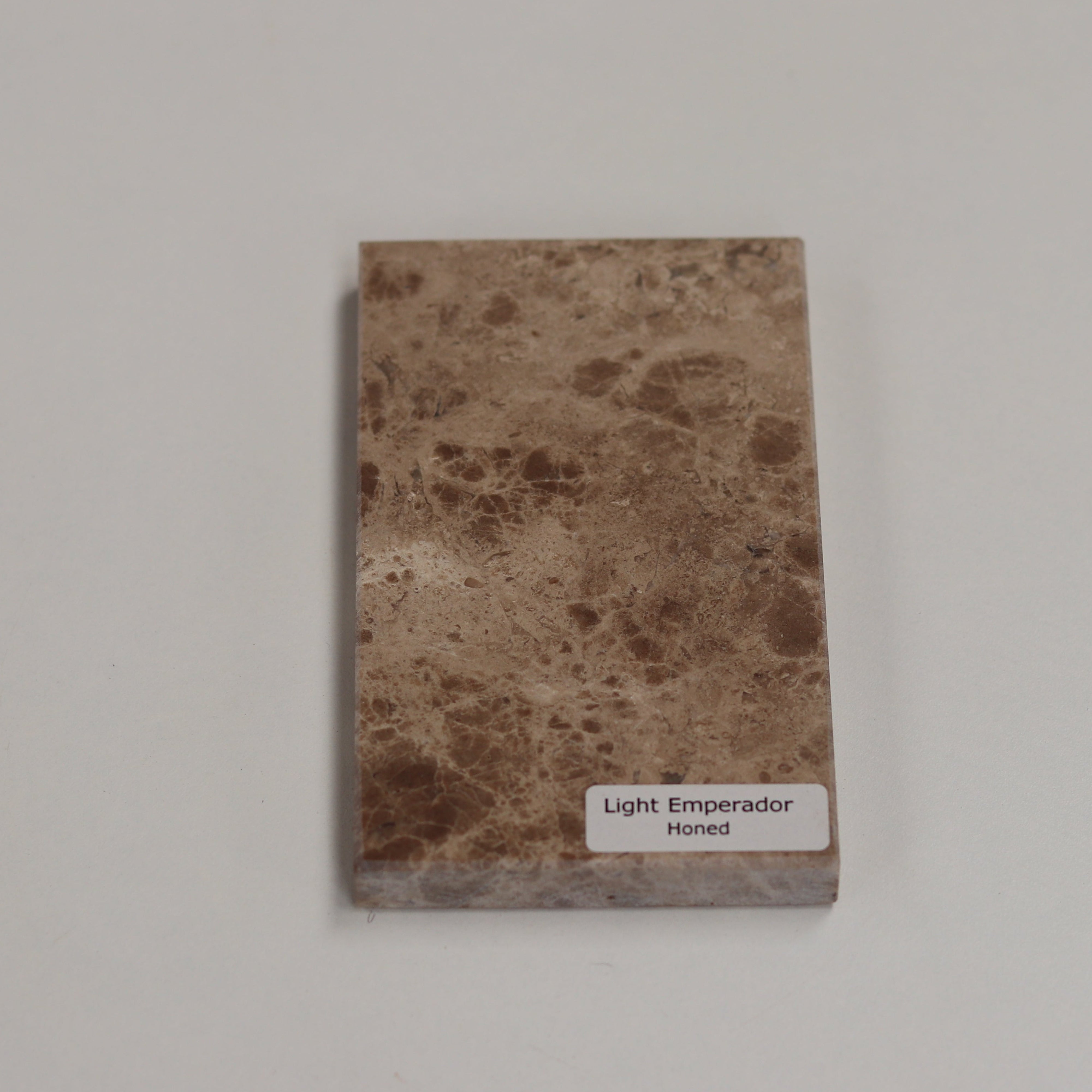 Honed Light Emperador — soft matte texture with warm brown tones