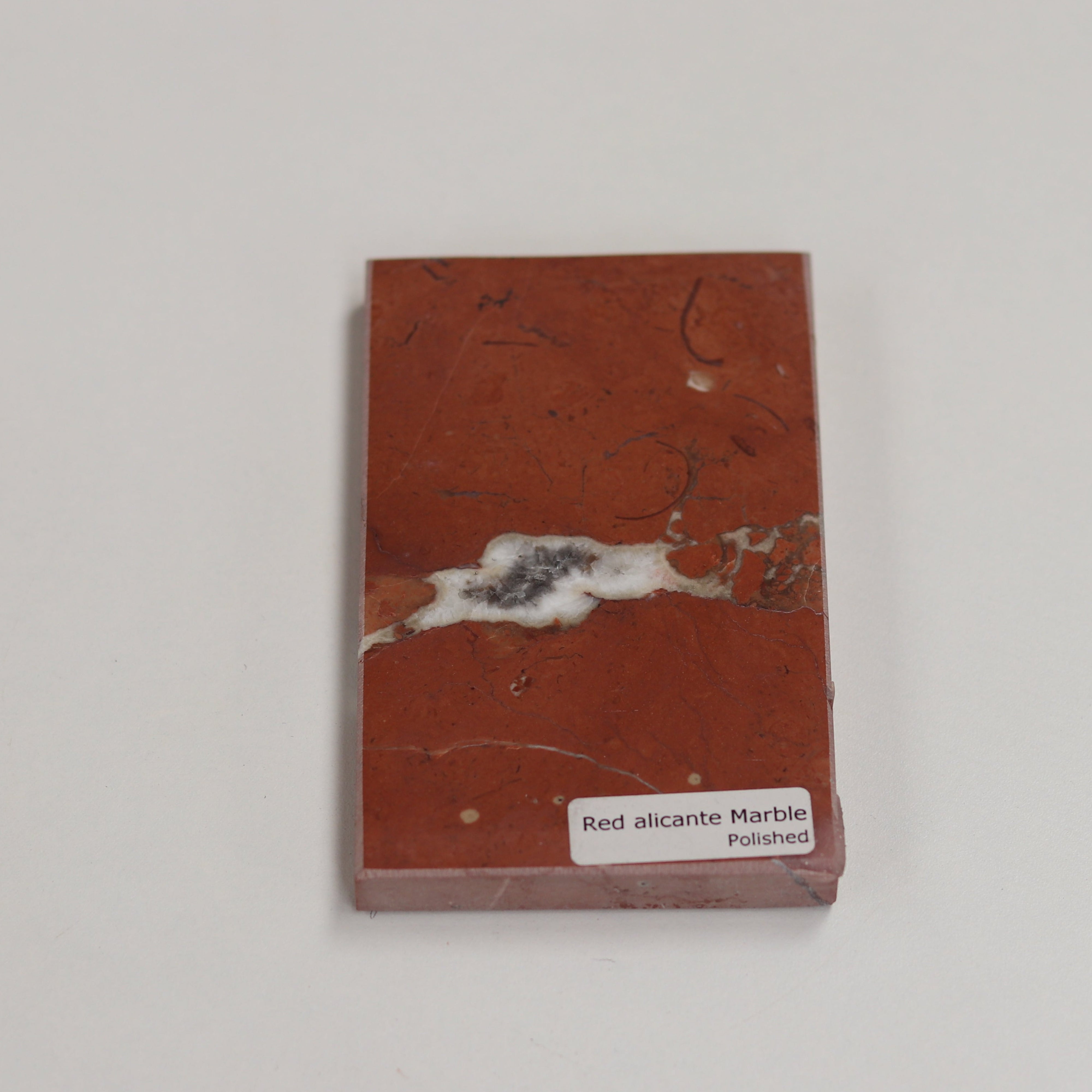 Polished Red Alicante — high‑gloss surface with rich red depth